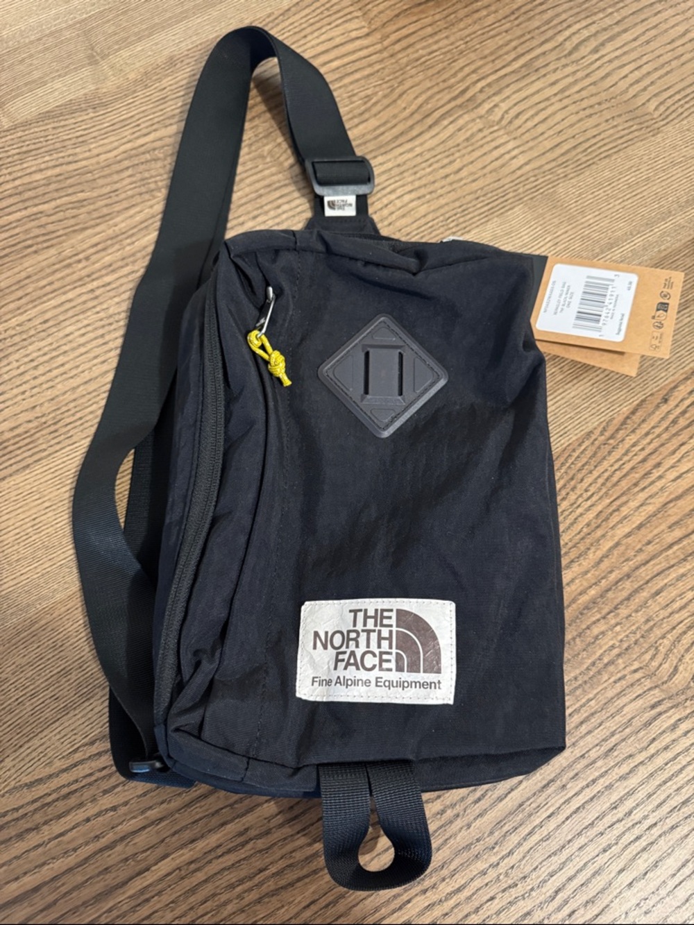 The North Face Black Crossbody Bag with Yellow Accent
